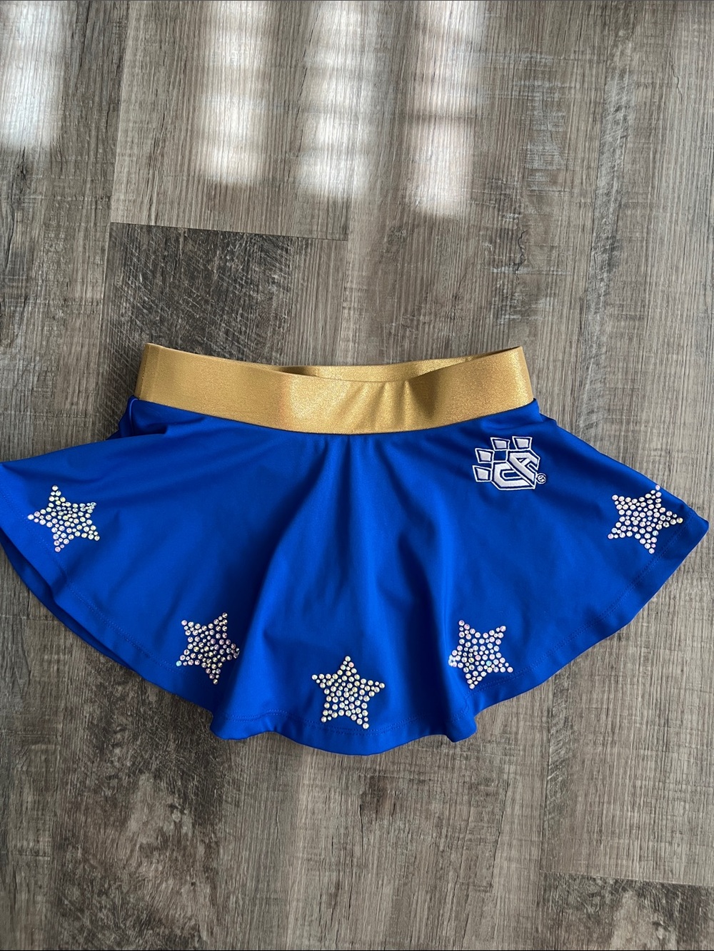 Cheer Athletics gold and royal blue skort with rhinestone stars size Youth L